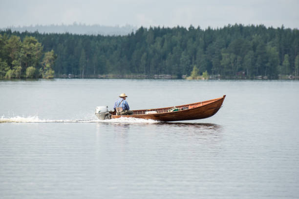 istock Driving with wooden motor boat 1149314788