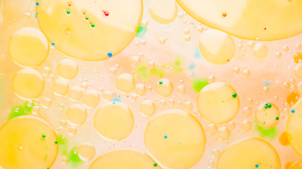 istock Multicolored background with oil on liquid. Abstract golden green background on liquid. Pattern with multicolored spots. Fluid art 1149317214