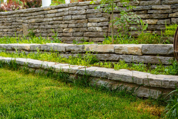 istock green lawn and stone path with stone walls 1149317418