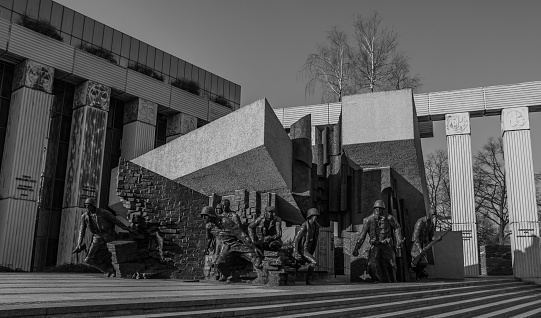 A black and white picture of the Warsaw Uprising Monument.