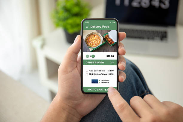 istock man hands holding phone with app delivery food on screen 1149317992