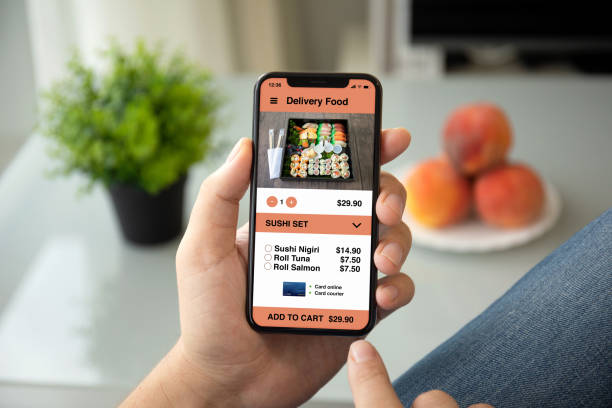 istock man hands holding phone with app delivery food on screen 1149318549