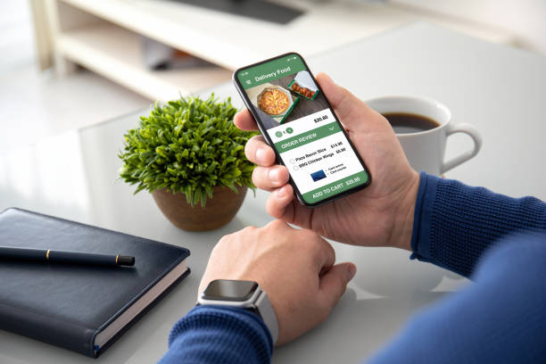 istock man hands watch holding with app delivery food on screen 1149318736