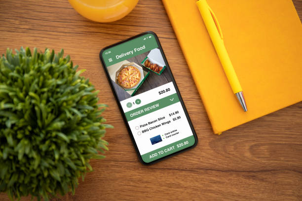 istock touch phone with app delivery food on the screen 1149318844
