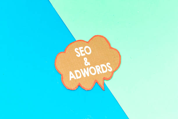 seo and adwords speech bubble isolated on pink and blue background - adsense imagens e fotografias de stock