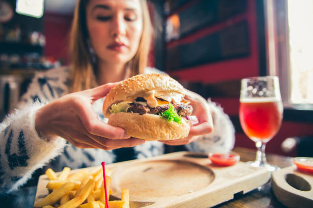 istock Young woman ready to eat Burger 1149322082