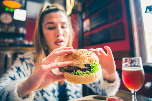 istock Young woman ready to eat Burger 1149322087