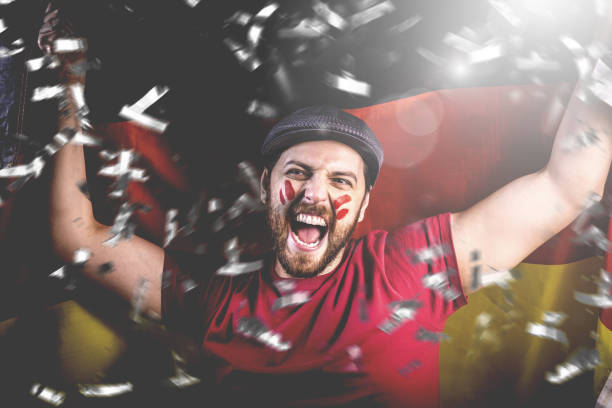 istock German fan celebrating with the national flag 1149322095