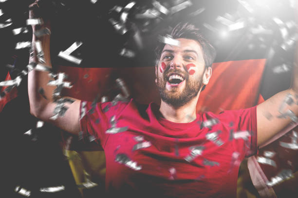 istock German fan celebrating with the national flag 1149322096
