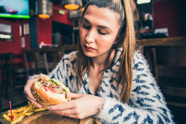 istock Young woman ready to eat Burger 1149322151