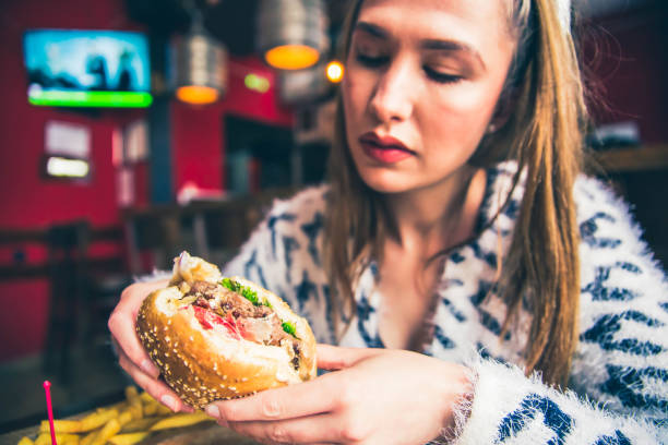 istock Delicious Burger in woman hand 1149322162