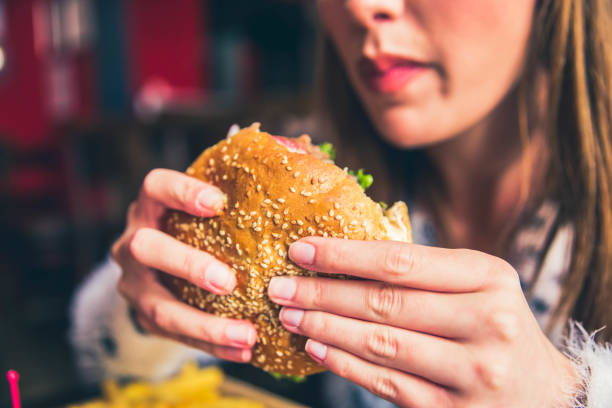 istock Woman ready to eat burger 1149322484