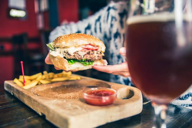 istock Burger in woman hand 1149322497