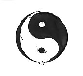 Splashes of black paint in the shape of a Yin Yang symbol, isolated on a white background