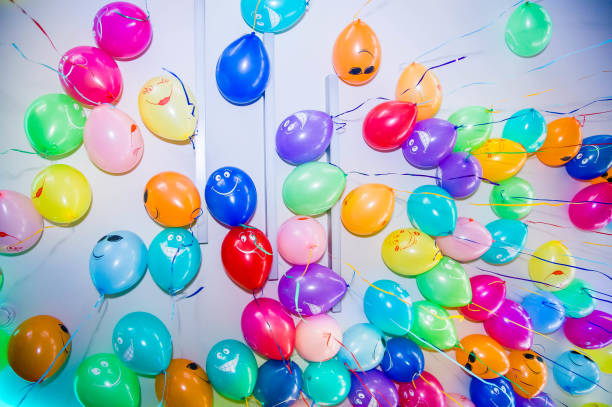 istock colorful balloons with emoji on the ceiling 1149325221
