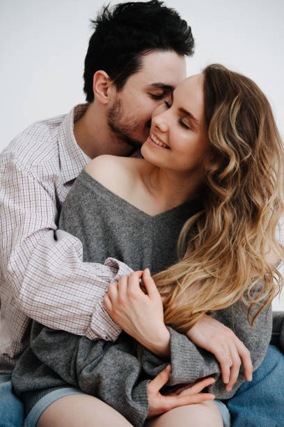 istock Beautiful couple is smiling and hugging while spending time together 1149326704