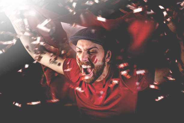 istock Swiss fan celebrating with the national flag 1149329507