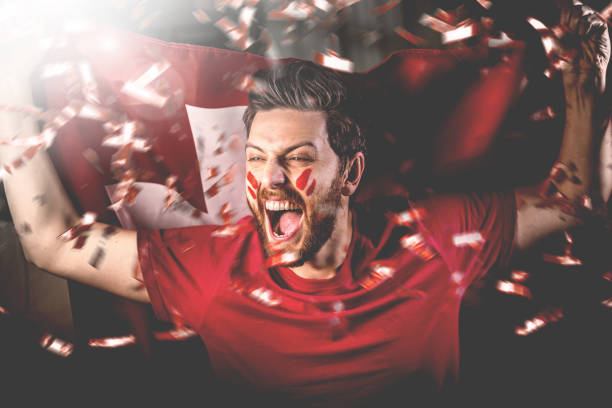 Swiss fan celebrating with the national flag Swiss fan celebrating with the national flag european football championship stock pictures, royalty-free photos & images