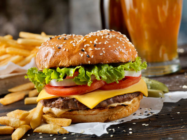 istock Classic Cheeseburger on a Brioche Bun with Fries and a Beer 1149329576