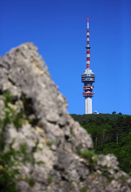 istock TV tower against blue sky with rock 1149332061