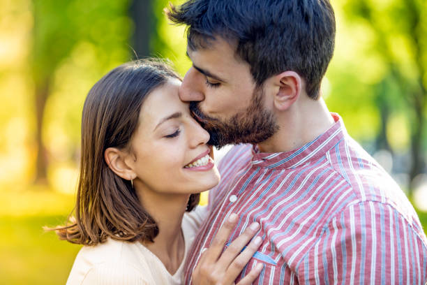 istock Young Couple is Enjoying Springtime in Park 1149332143