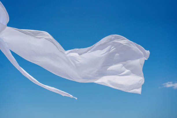 istock Piece of white airy fabric fluttering in the wind. 1149332224