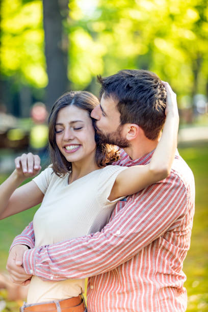 istock Young Couple is Enjoying Springtime in Park 1149332876