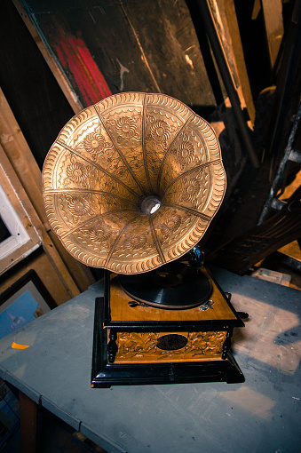 wooden gramophone with an ornament on the  brass megaphone