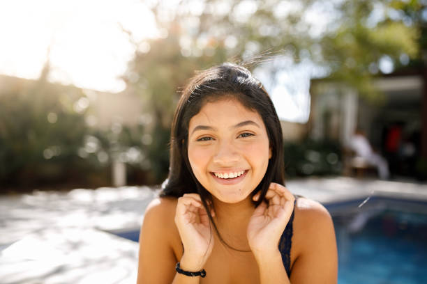 istock Brunette girl fixing her hair 1149335913