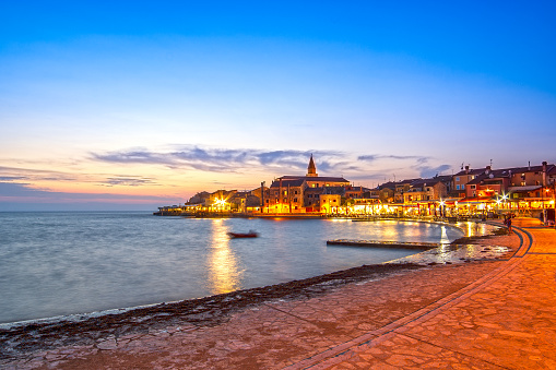 Umag, town in Istria peninsula, Croatia, at Adriatic Sea, viewed at sunset.