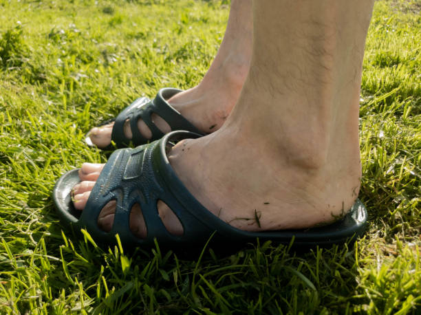 istock A man puts on a slap on the grass slow motion 1149340100