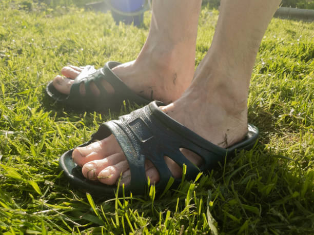 istock A man puts on a slap on the grass slow motion 1149340117