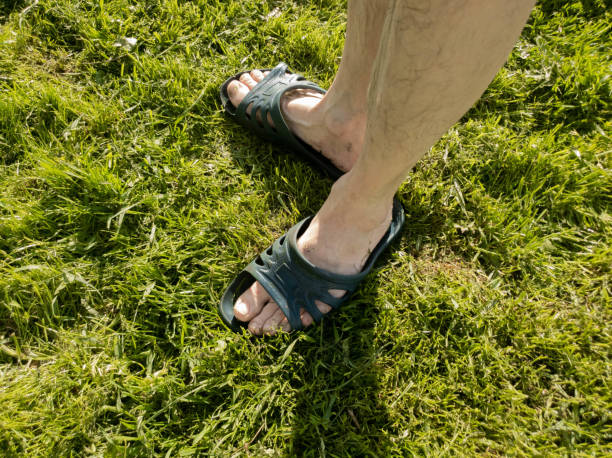 istock A man puts on a slap on the grass slow motion 1149340131