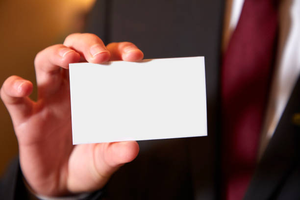 istock Male hand showing empty business card 1149340188