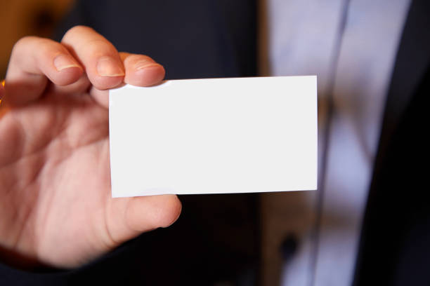 istock Male hand showing empty business card 1149340281
