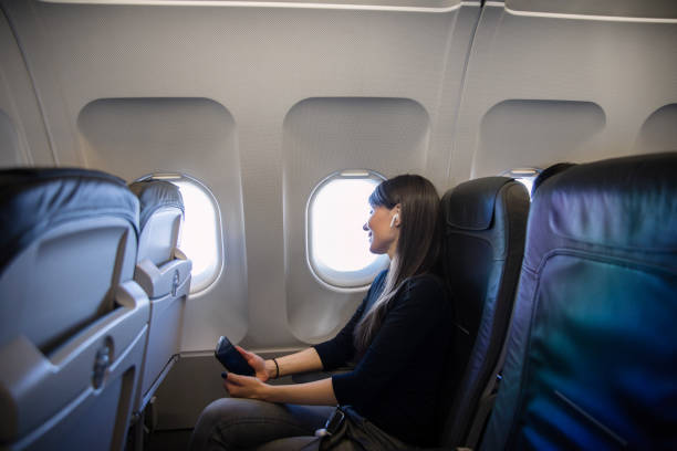 istock Women at airplane 1149340425