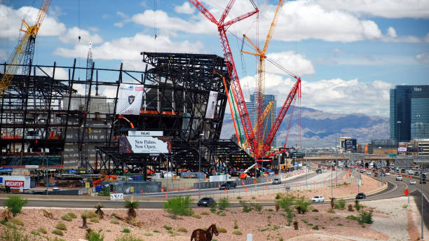 New football stadium under construction in Las Vegas Las Vegas, United States - May 12 2019: New football stadium under construction in Las Vegas Nevada  USA.It will be completed in 2020 and will be home stadium to Raiders. nevada highway stock pictures, royalty-free photos & images