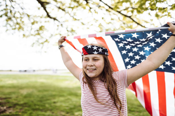 istock little kid running with us flag 1149343031