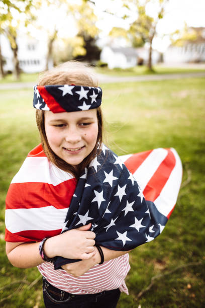 istock little kid running with us flag 1149343143