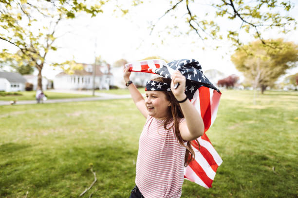 istock little kid running with us flag 1149343788