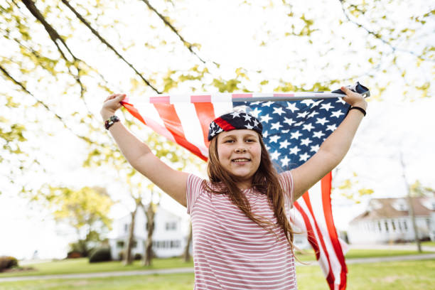 istock little kid running with us flag 1149343944