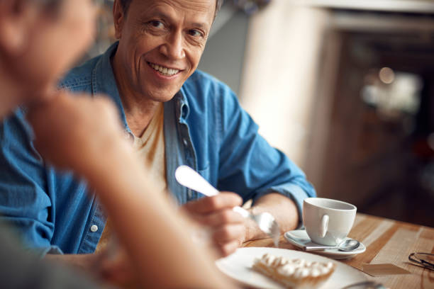 istock Happy smiling aged man looking to female 1149345397