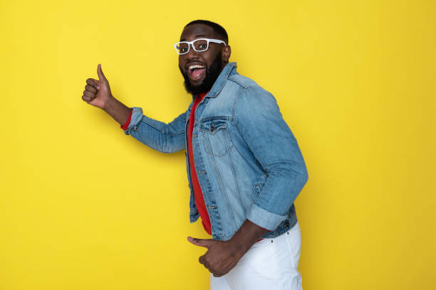 istock Side view of bearded African man with opened mouth posing in studio 1149351806