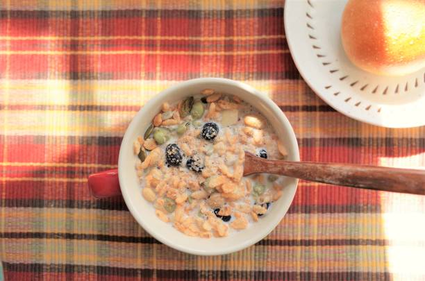 Healthy granola breakfast, eating organic locabo muesli stock photo