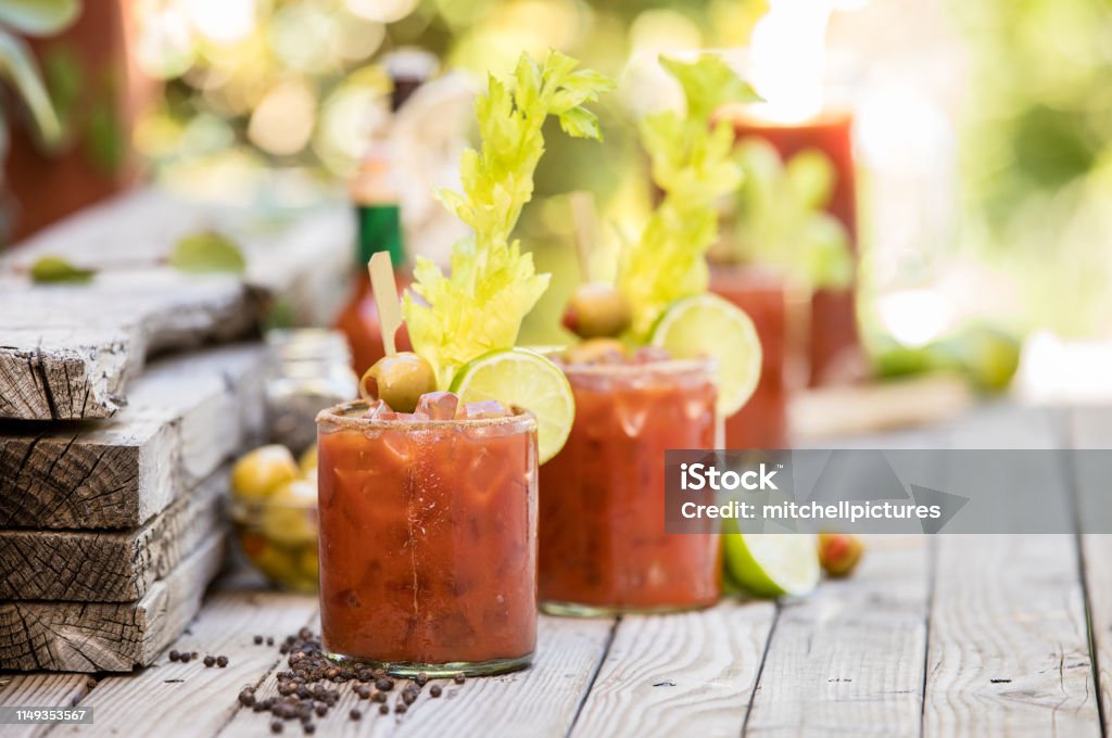 Bloody Mary's Group of bloody mary's on an outside table ready for a party Bloody Mary Stock Photo