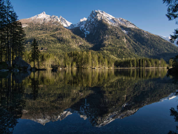istock The mountains are reflected in the clear lake 1149353852