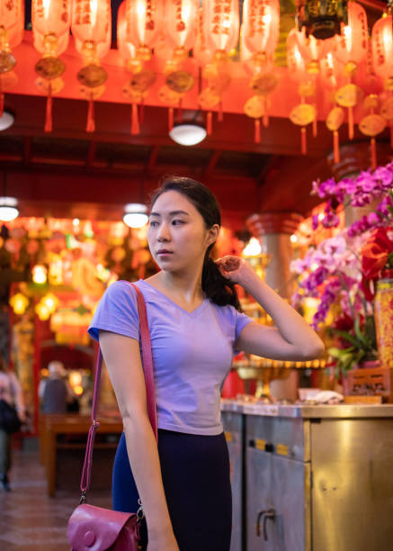 istock Young woman visiting temple in Taipei 1149355622