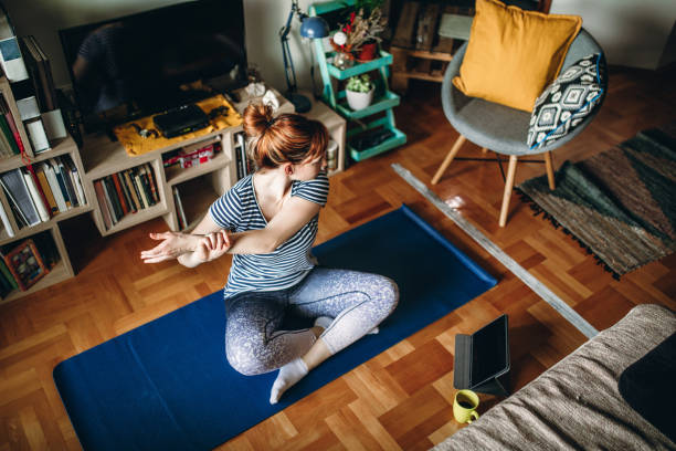 woman practicing yoga - people joy relaxation concentration imagens e fotografias de stock