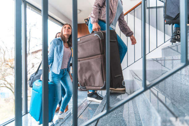 istock Multi-ethnic female friends moving up on staircase 1149367916