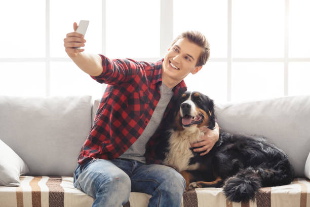 istock Young person with dog at home leisure 1149368329